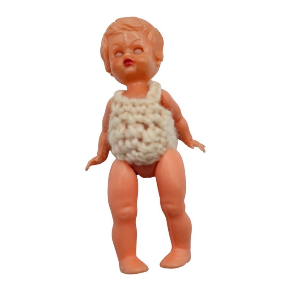 vintage Redbox hard plastic baby doll, likely from the 1950s to early 1980s